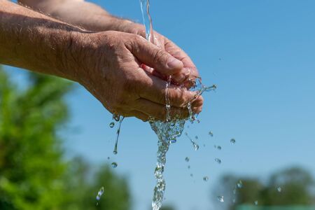Hand washing in running water.の写真素材