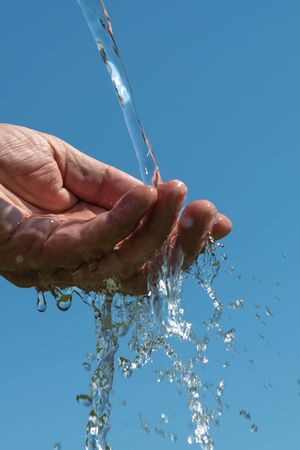 Hand washing in running water.の写真素材