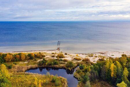 Coast of gulf of Riga, Baltic sea in still autumn day.の写真素材