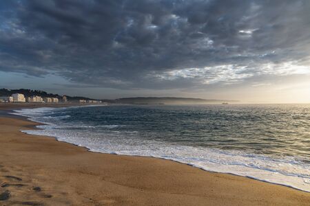 Evening time at Atlantic ocean in Nazare, Portugal.の写真素材