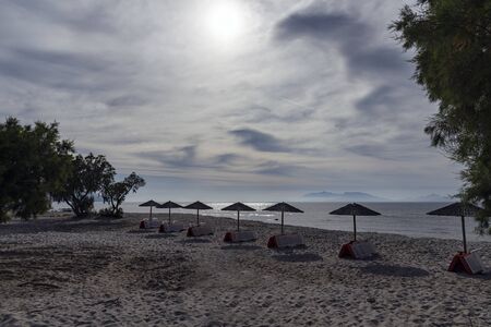 Umbrellas on Kardamena city beach in Kos island, Greece.の写真素材