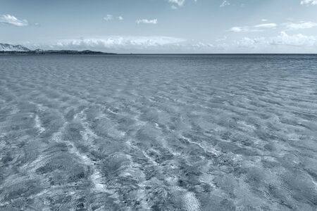 Sunny day by blue sea.の写真素材