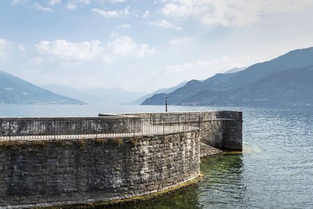 Como lake coasts in hot summer morning, Lombardy, Italy.の写真素材