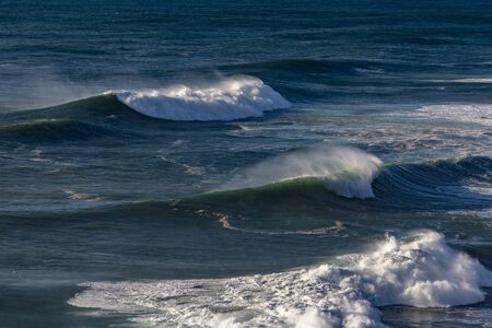 Foamy Atlantic ocean wave at Portugal coast.の写真素材