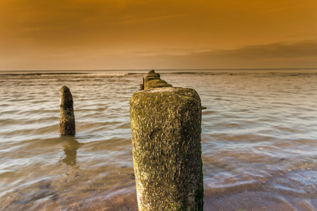 Old fishing boat pier at Baltic sea coast.