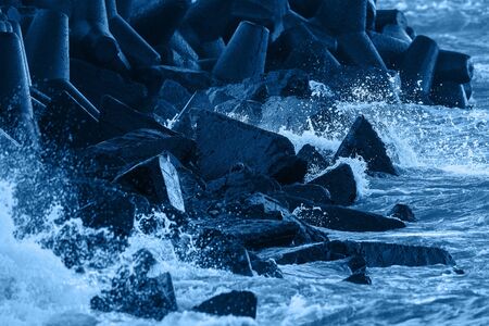 Breakwater in stormy sea water.の写真素材