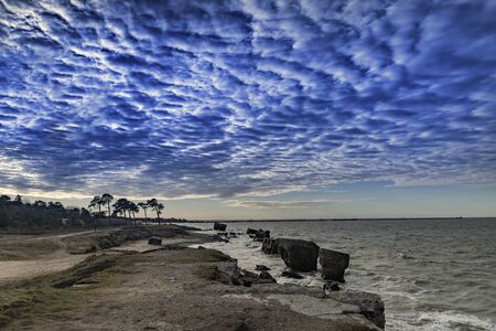 Remains of military fortifications in stormy Baltic sea near Liepaja, Latvia.の写真素材