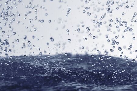 Falling water drops in frozen motion.の写真素材