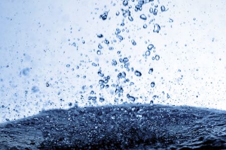 Falling water drops in frozen motion.の写真素材