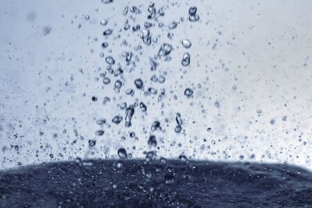 Falling water drops in frozen motion.の写真素材