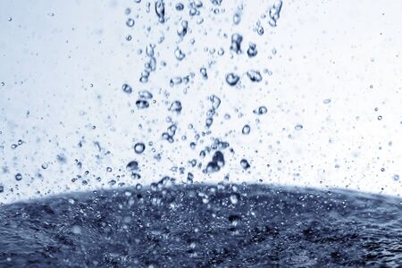 Falling water drops in frozen motion.の写真素材