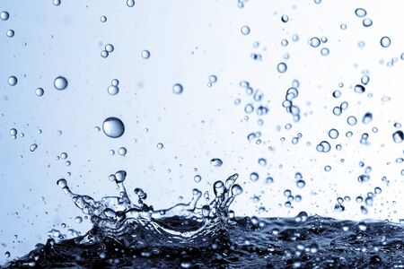 Falling water drops in frozen motion.の写真素材