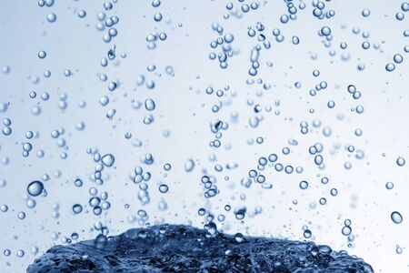 Falling water drops in frozen motion.の写真素材