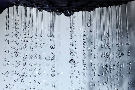 Shower head and falling water drops.の写真素材