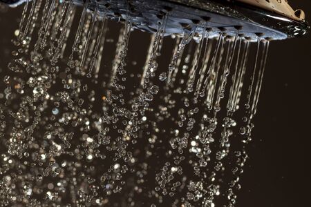 Shower head and falling water drops.の写真素材