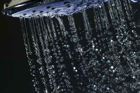 Shower head and falling water drops.の写真素材