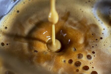 Fresh coffee in transparent cup.の写真素材