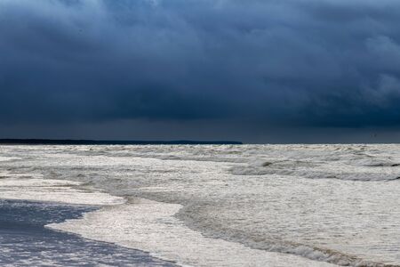 Dark clouds over Baltic sea.の写真素材