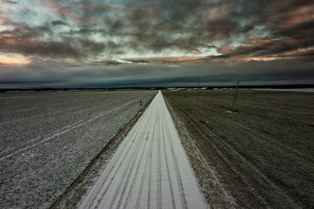 Little snow on land in cold december day, countryside of Latvia.の写真素材