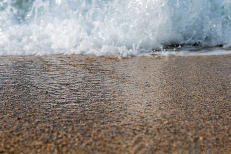 Splashing sea water on Corfu beach, Grecce.の写真素材