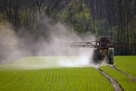 Sprayer on a green crop field in spring.の写真素材