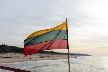 Lithuanian flag in wind at coast of Lithuania.の写真素材