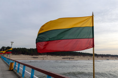 Lithuanian flag in wind at coast of Lithuania.の写真素材