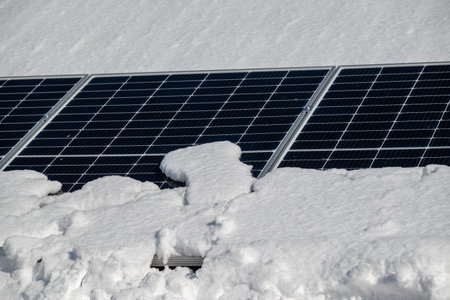 Solar panels under snow in winter.