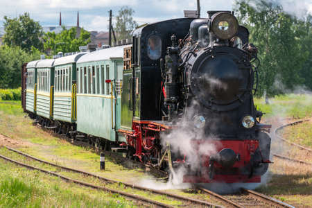 Narrow gauge train with a steam locomotive on the line Gulbene - Aluksne, Latvia.の写真素材