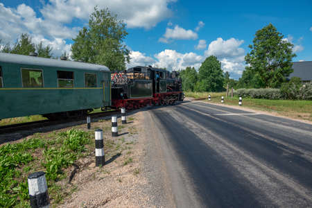 Narrow gauge train with a steam locomotive on the line Gulbene - Aluksne, Latvia.の写真素材