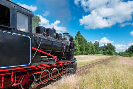 Narrow gauge train with a steam locomotive on the line Gulbene - Aluksne, Latvia.の写真素材