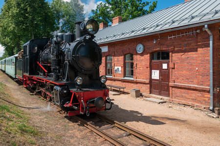Narrow gauge train with a steam locomotive on the line Gulbene - Aluksne, Latvia.の写真素材
