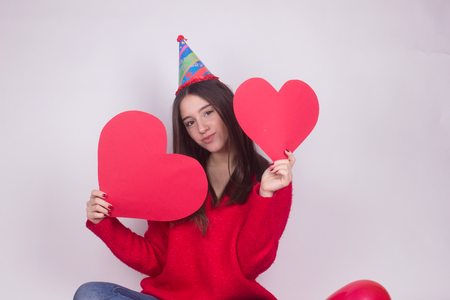 portrait girl with hearts isolated on whiteの写真素材