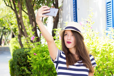 girl smartphone selfie posingの写真素材