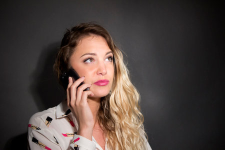 beautiful woman speak at the telephoneの写真素材