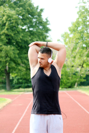 young sporty man stretchingの写真素材