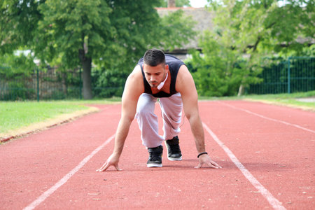 young man running outsideの写真素材
