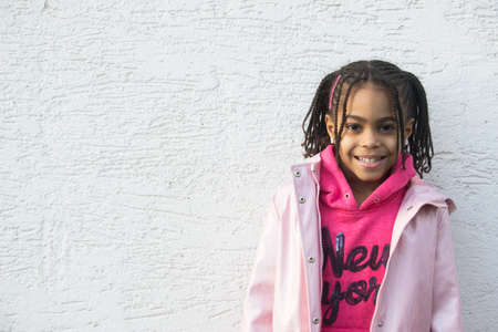 Portrait of cute mixed little girlの写真素材