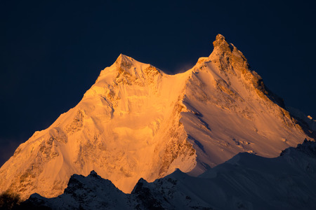 Manaslu Peak -  the eighth highest mountain in the world. Nepal, Himalayas, Manaslu restricted area, sunrise above Manaslu peak 8,156 m.の写真素材