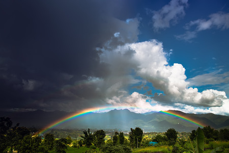 Bright rainbow after the heavy rain.の写真素材