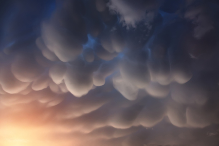 Mammatus clouds are pouch-like cloud structures. Its a strange and very rare formations of clouds in sinking air.の写真素材