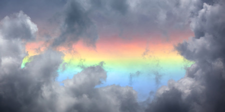 The brightly colored circumhorizon arc visible when the sun is very high in the sky - higher than 58. It is a very large halo and always parallel to the horizon.の写真素材