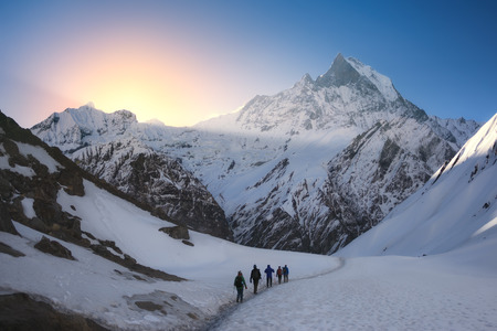 A group of trekkers are walking in the mountains. Nepal, Himalayas, Annapurna region.の写真素材