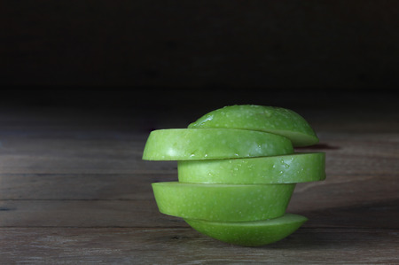 Apple slices into stacked pieces.の写真素材
