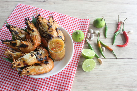 Grilled lobster with seafood sauce and ingredients.の写真素材