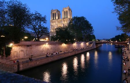 Notre Dame cathedral in Paris at nightの写真素材