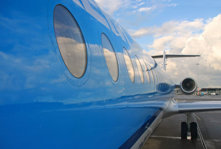Windows of an airplane waiting for takeoffの写真素材