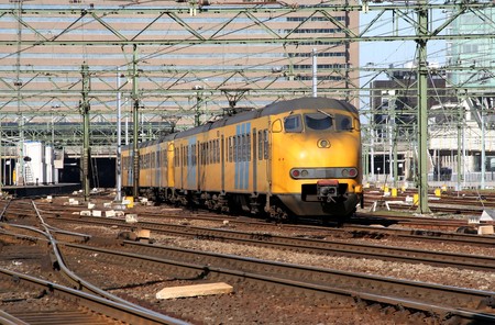 Commuter train entering the railway stationの写真素材