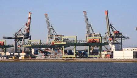 Harbor with large cranes and containers in Rotterdam, Holland