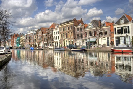 Historical houses along a canal in Leiden, Hollandの写真素材